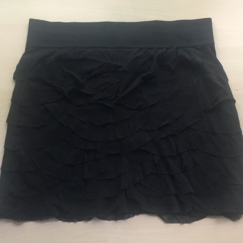 Women’s black ruffled skirt.